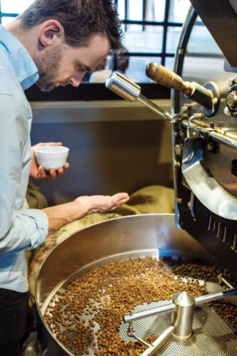 Crema's head roaster and Q grader, Winston Harrison, at work.