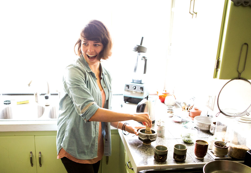 Lauren Purvis, owner of Mizuba Matcha, whisks tea in her Portland home. (Photo: Cory Eldridge.)