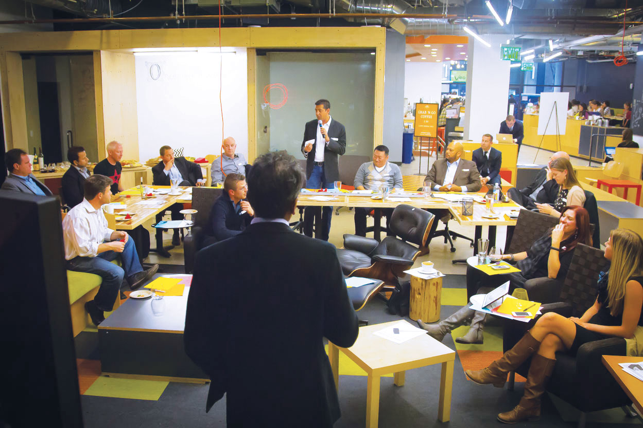 A speaker talks to a group at Workshop Café in San Francisco. (Photo: courtesy Workshop Café.)