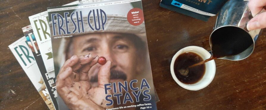 Pouring a fresh cup of coffee with old issues of Fresh Cup Magazine